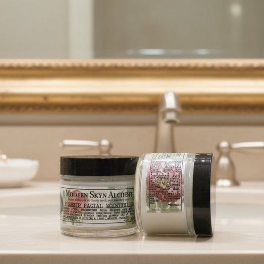 Two jars of facial moisturizer from Modern Skyn Alchemy on a wooden surface.