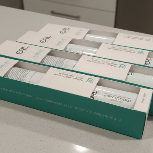 Multiple boxes of a skincare product on a gray surface