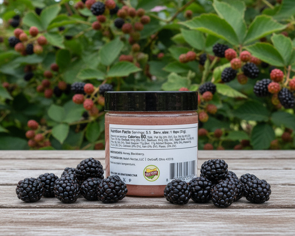 jar of blackberry honey on a table outside
