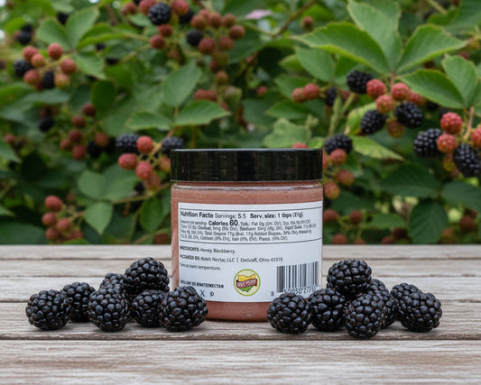 jar of blackberry honey on a table outside