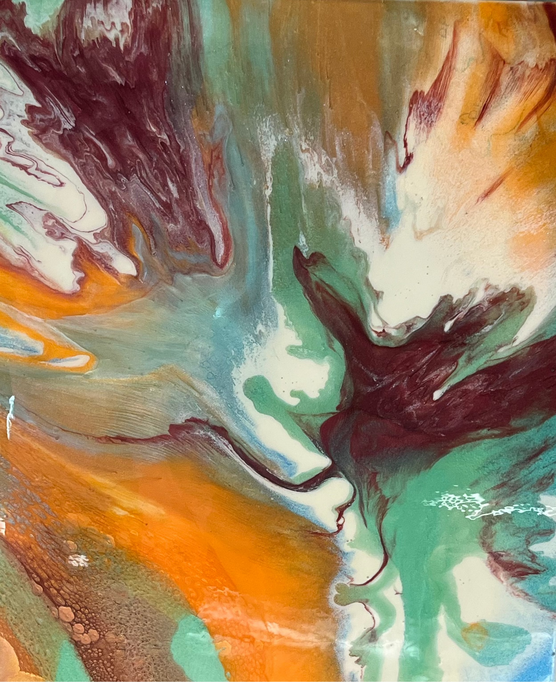 Abstract art with swirling colors in brown, green, and orange.