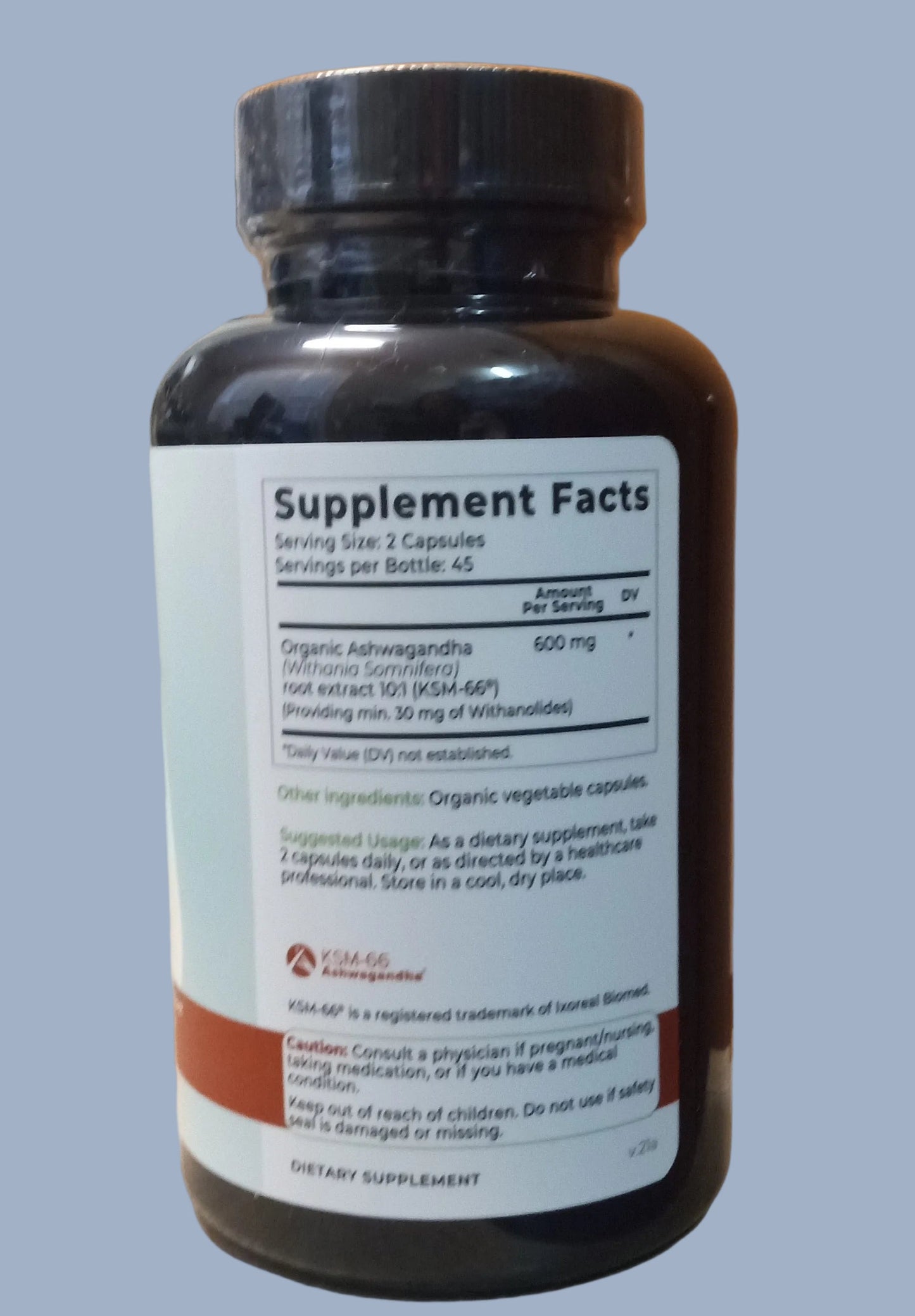 Supplement bottle with label on a wooden surface