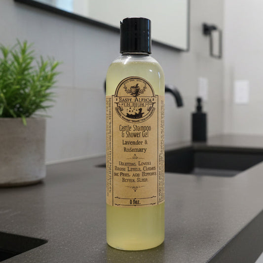 Bottle of olive oil with a label held by a person, on a blurred background.