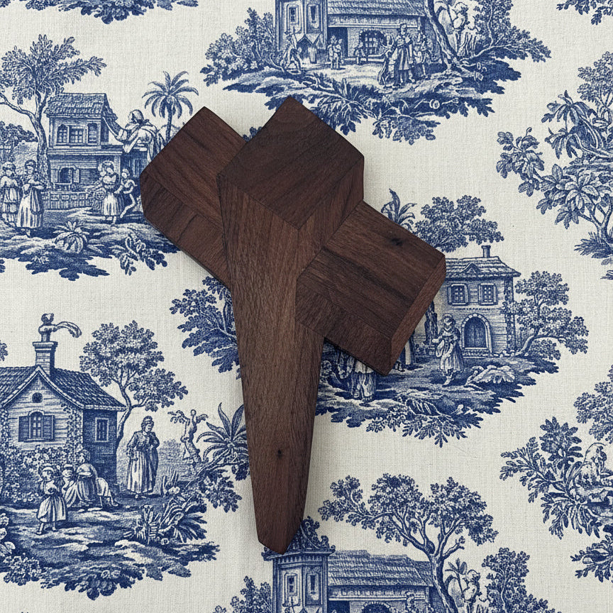 Wooden cross on a white wall