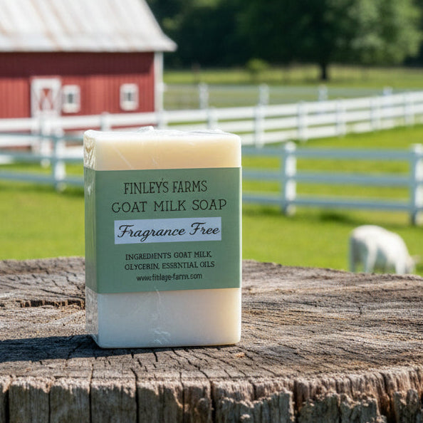 Bar of goat milk soap with a green label on a wooden surface