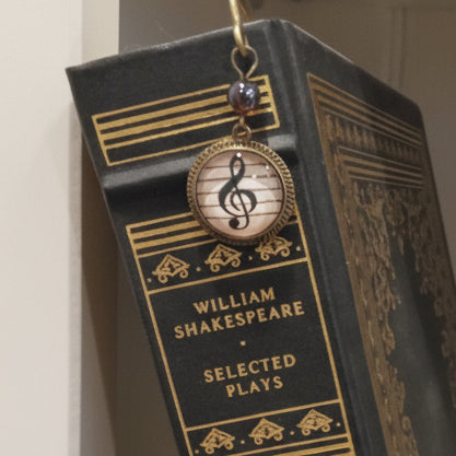 Treble clef book mark elegantly hangs on the spine