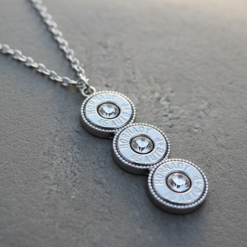 Necklace with circular pendants and crystals on a wooden surface