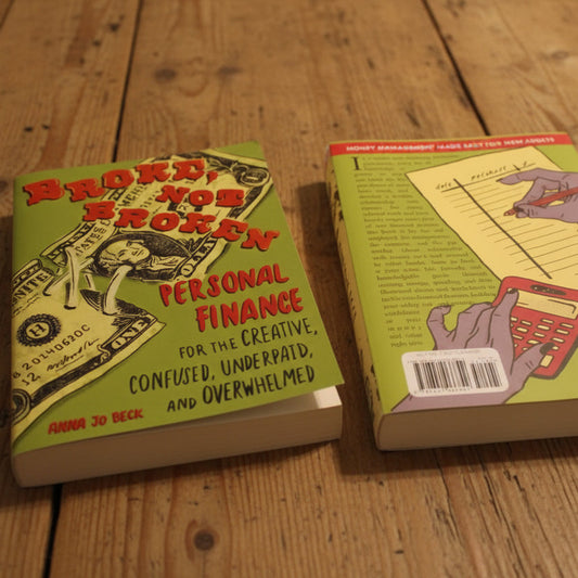 Two books on a surface with colorful covers and text.