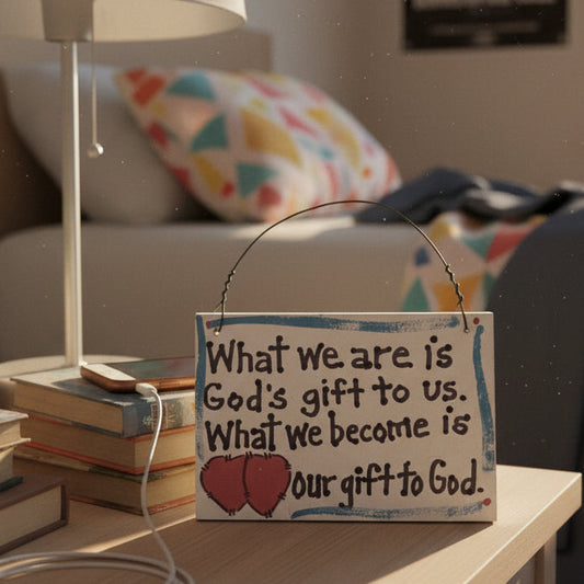 Decorative sign on a table with books and a lamp in a cozy room.