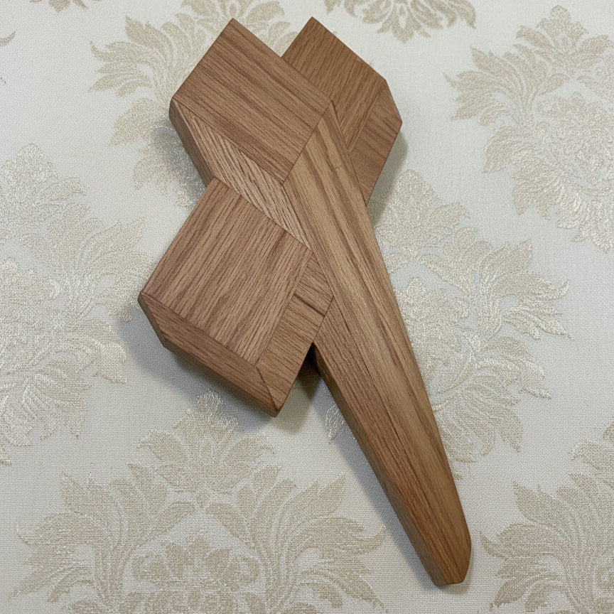 Wooden geometric puzzle on a dark background