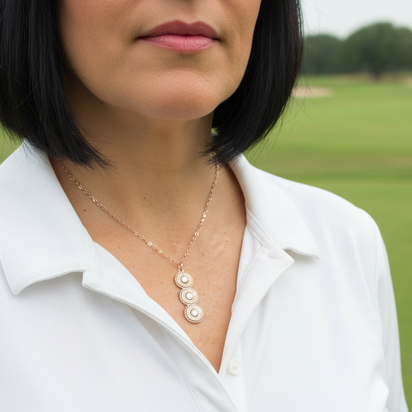 Woman golfer wears the bullet casing necklace