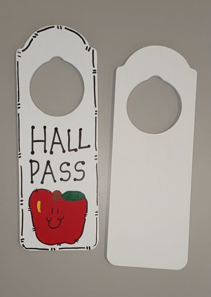Hall pass with a red apple design on a light pink background